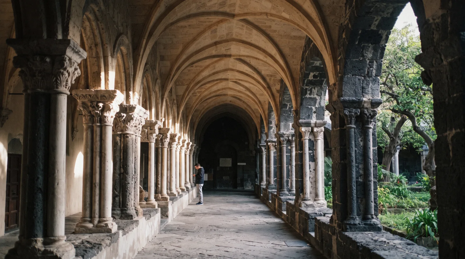 The Chiostro di San Francesco in Sorrento, crossed tuff arches and columns around a small garden courtyard