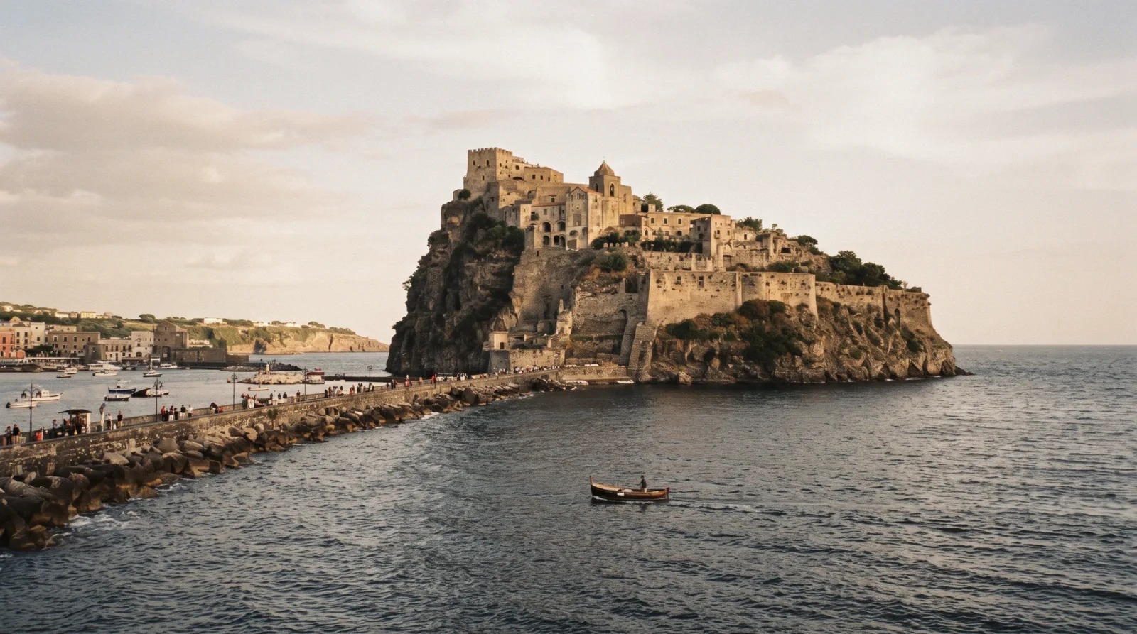 The Aragonese Castle on its rock causeway at Ischia Ponte seen across the water in morning light